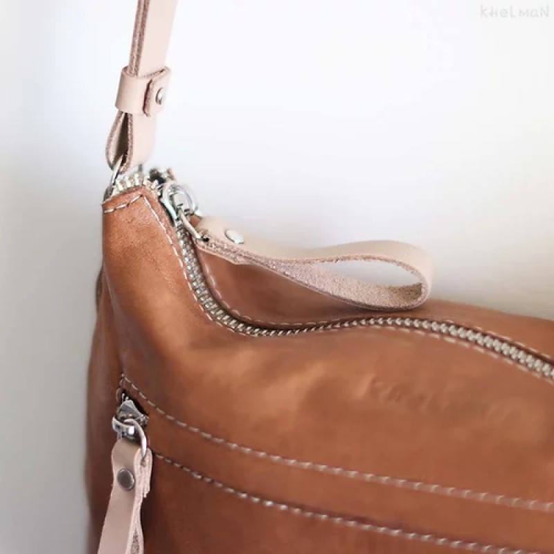 Borla. Tan wood lamb crossbody purse