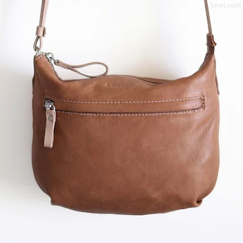 Borla. Tan wood lamb crossbody purse